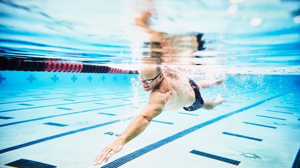 A man swims laps in a pool.