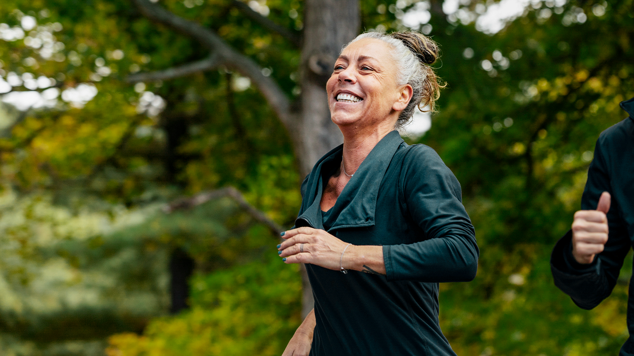 https://post.healthline.com/wp-content/uploads/2019/01/happy-mature-woman-jogging-header-1.png