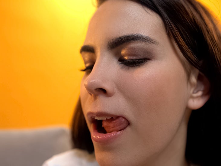 Why do girls bite their lips