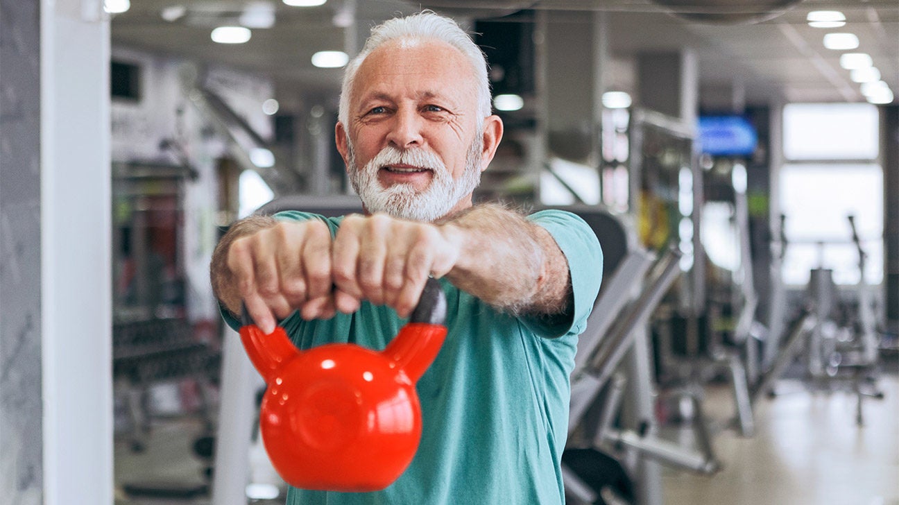 A man works out with kettlebell.