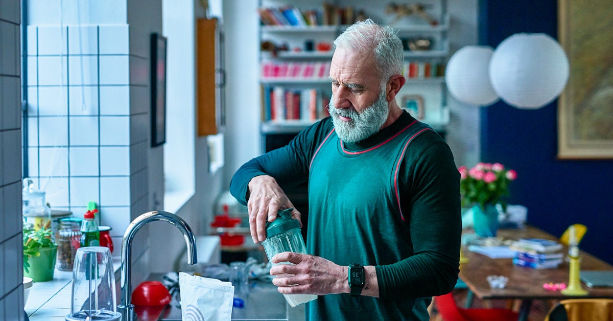 Senior man making protein shake before exercising 1200x628 facebook