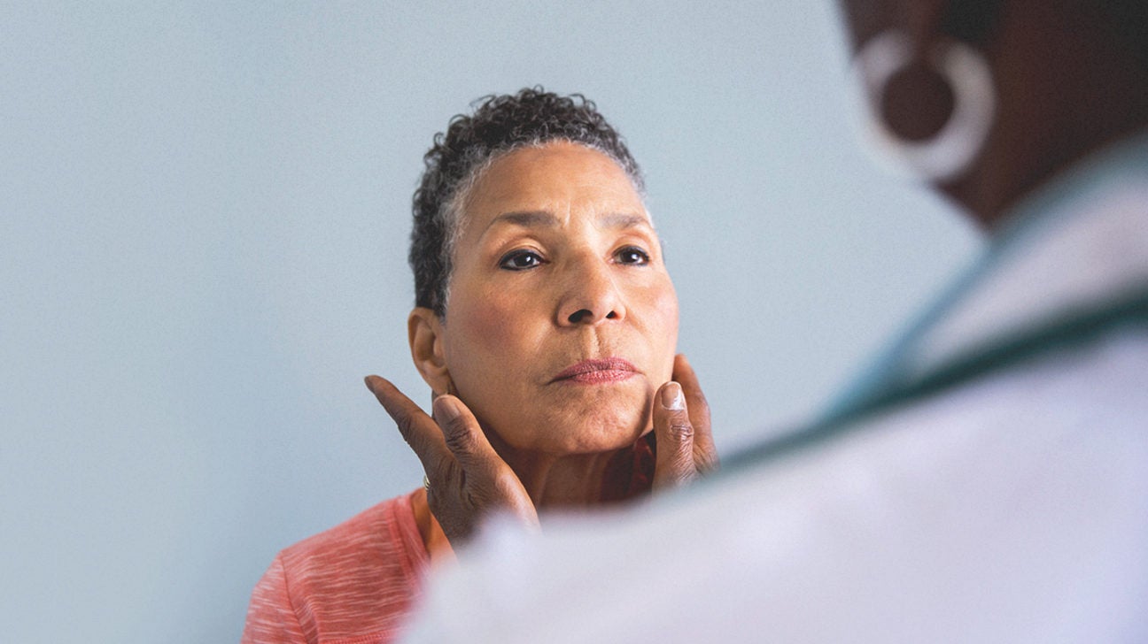 Doctor examining senior patient
