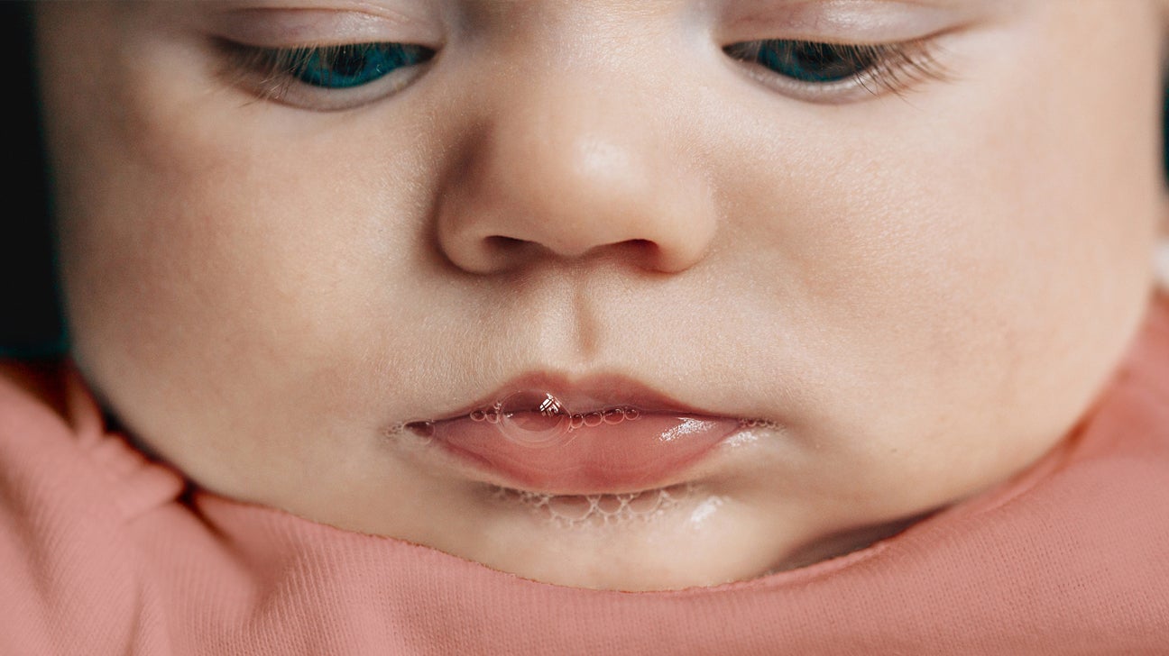 Baby Spitting Up Clear Liquid? Causes and When to Call the Doctor