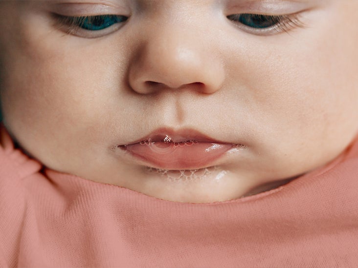 baby spitting up at bedtime