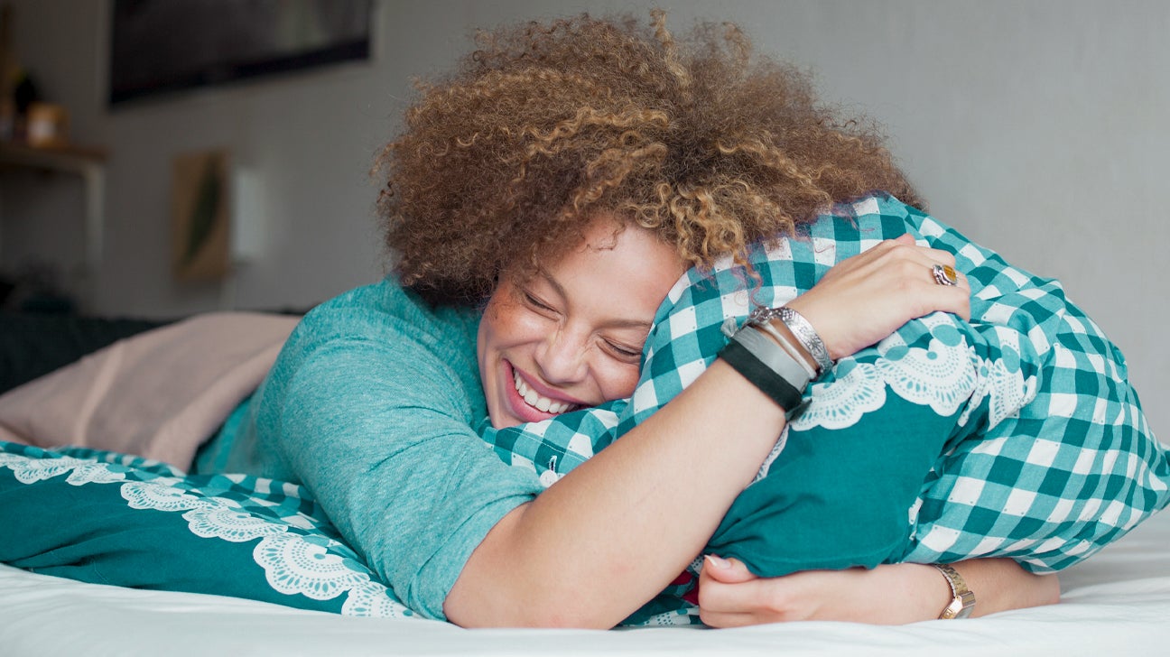 https://post.healthline.com/wp-content/uploads/2020/05/Happy-woman-with-closed-eyes-holding-pillow-1296x728-header.jpg