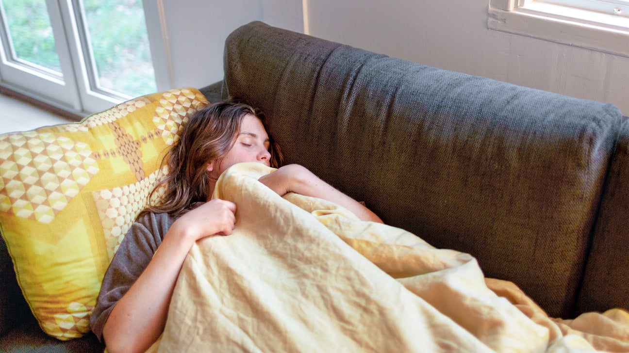 https://post.healthline.com/wp-content/uploads/2020/05/Woman-sleeping-on-sofa-1296x728-header.jpg