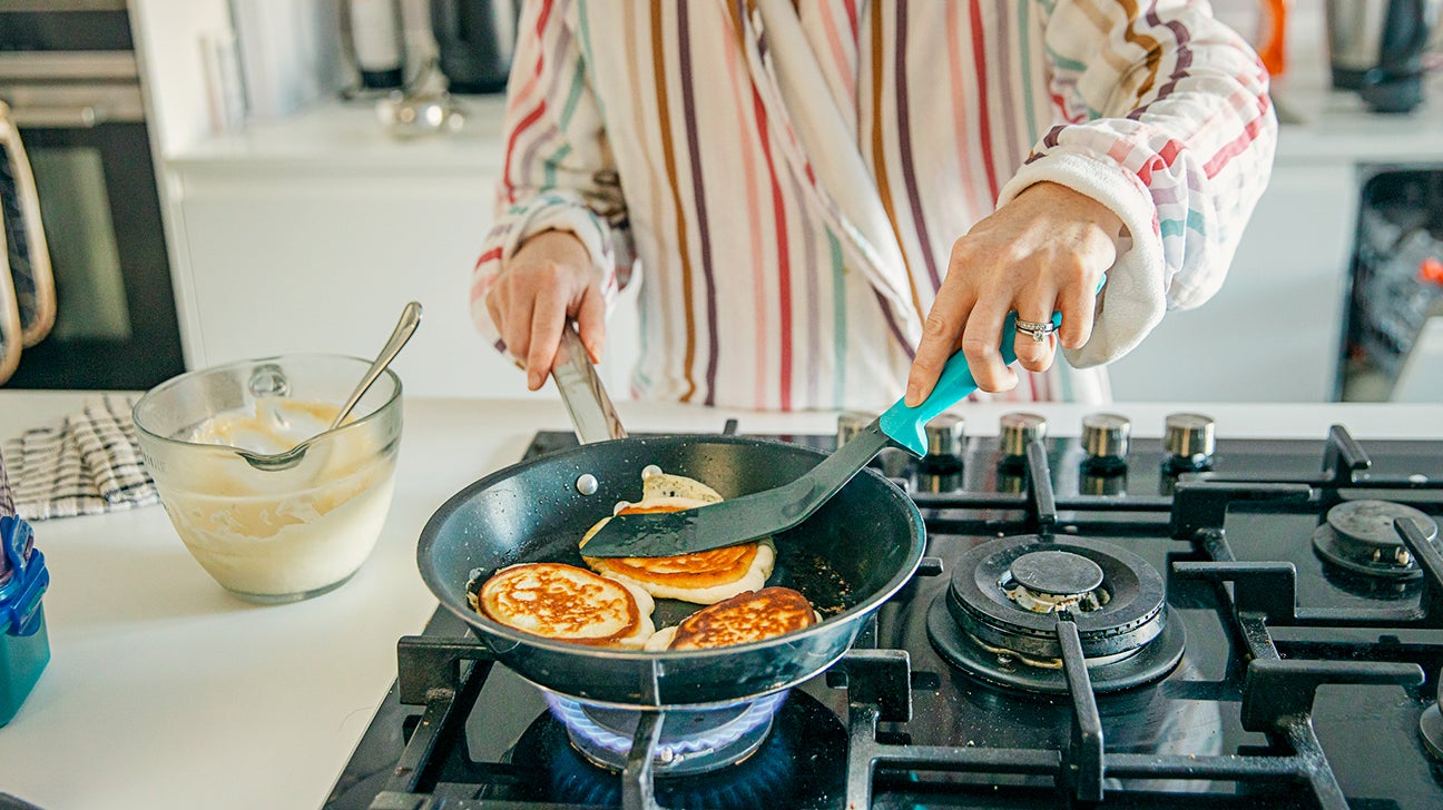 https://post.healthline.com/wp-content/uploads/2020/06/Woman-cooking-homemade-pancakes-header.jpg