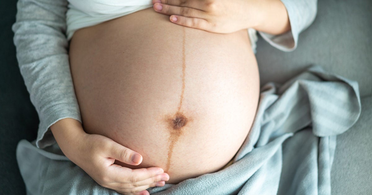 cramps around belly button during early pregnancy