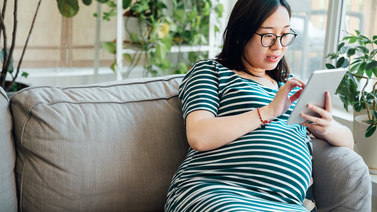 Pregnant Woman Reading Pregnancy Female On Chair With Book Waiting