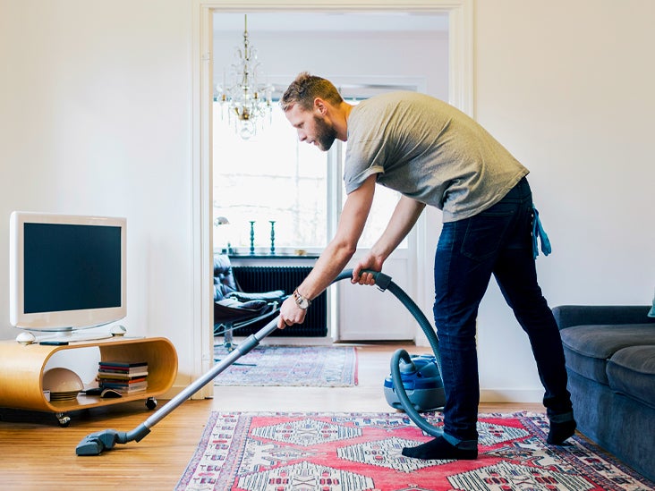 Side view of man vacuuming hardwood floor 732x549 thumbnail
