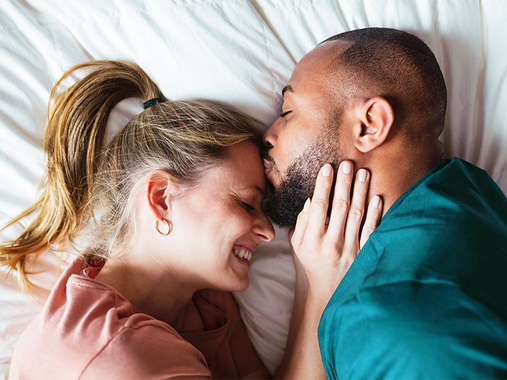 mixed race couple kissing bed 732x549 thumbnail