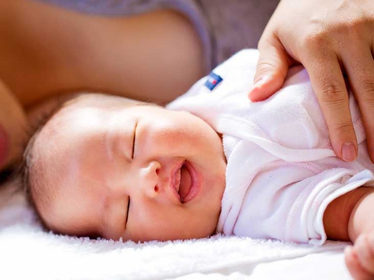 baby laughing at 1 month