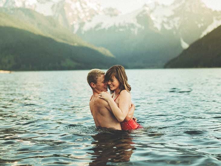 Cute couple is having a rest on the beach naked