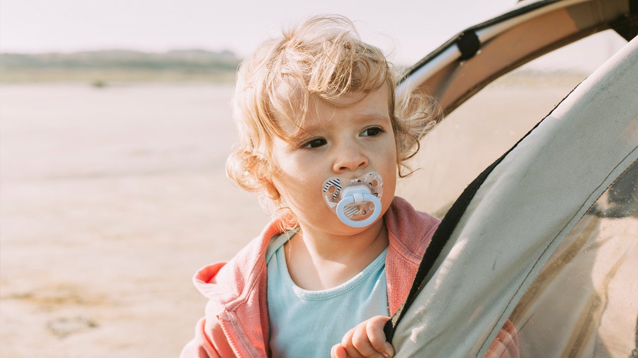 https://post.healthline.com/wp-content/uploads/2020/12/baby-and-pacifier-camping-1296x728-header.jpg