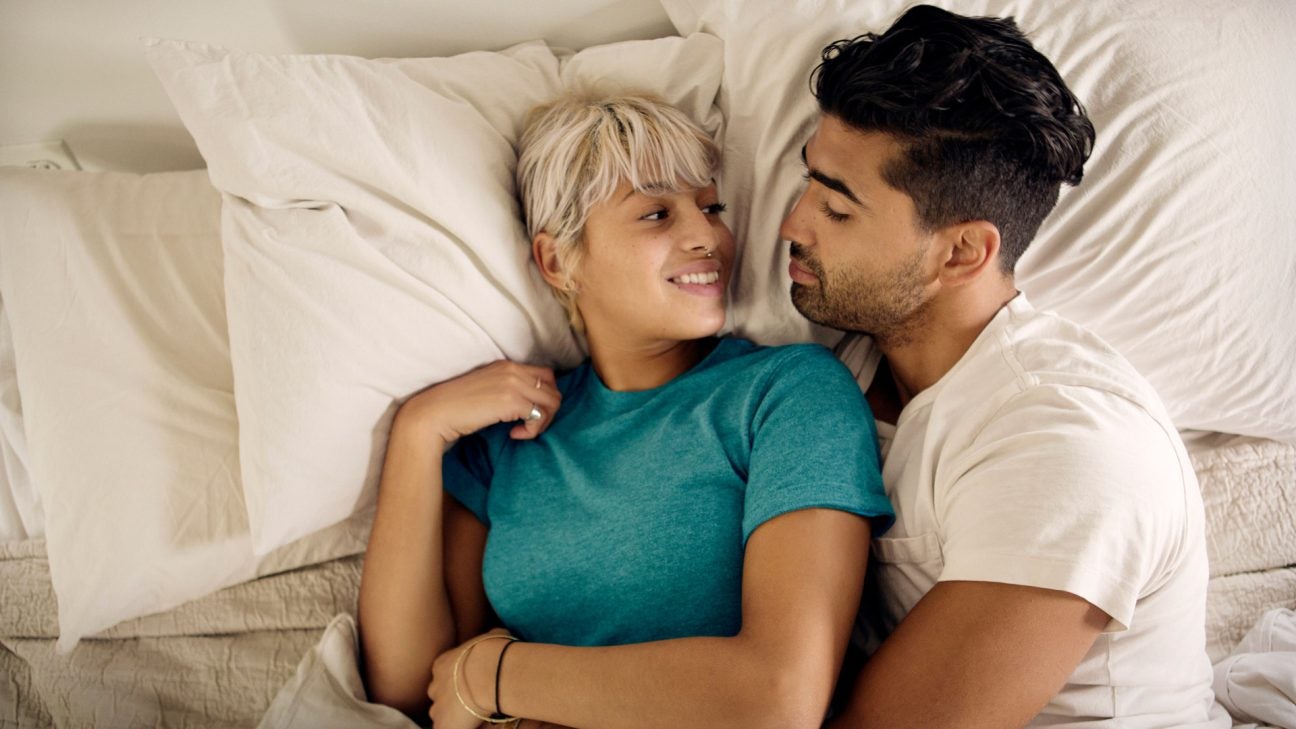 couple_canoodling_in_bed_talking-x-header-x