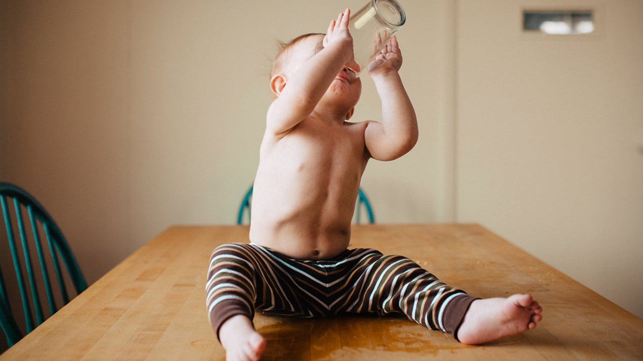 https://post.healthline.com/wp-content/uploads/2021/05/toddler-drinkng-out-of-glass-cup-1296x728-header-1.jpg