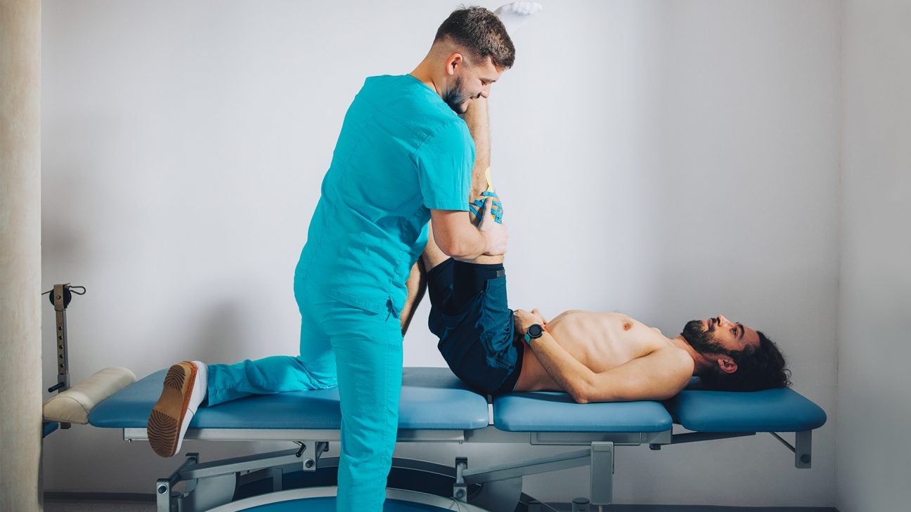 https://post.healthline.com/wp-content/uploads/2021/07/chiropractor_stretching_and_treating_for_sciatica-1296x728-header-1296x729.jpg