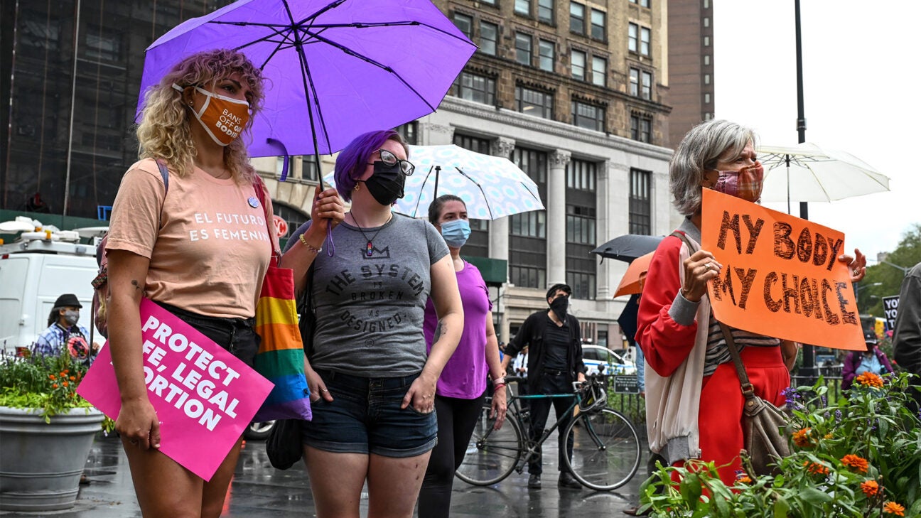 This image has an empty alt attribute; its file name is Females_Protest_Signs_1296x728-header-1-1296x729.jpg