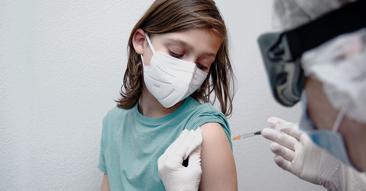 doctor giving boy covid 19 vaccine facemask 1200x628 facebook