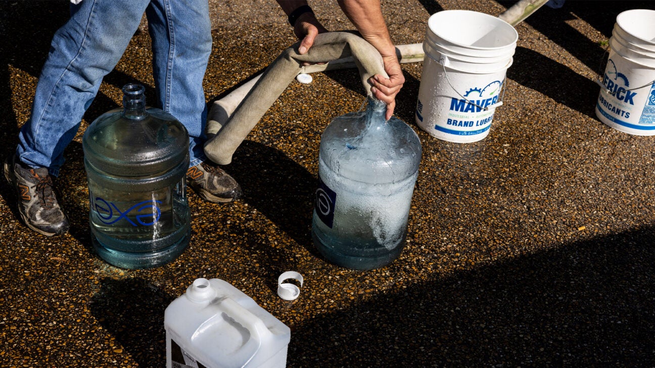 People fill up water jugs in Mississippi.