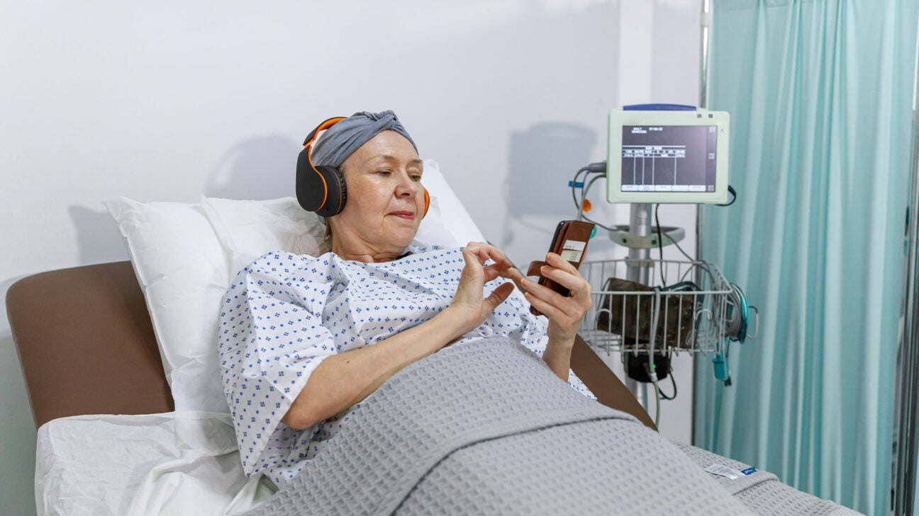 Woman in a hospital bed.