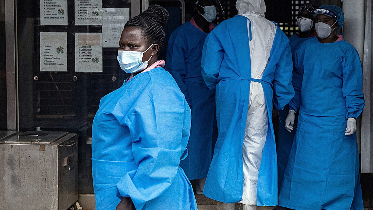 Health providers outside a treatment center in Uganda.