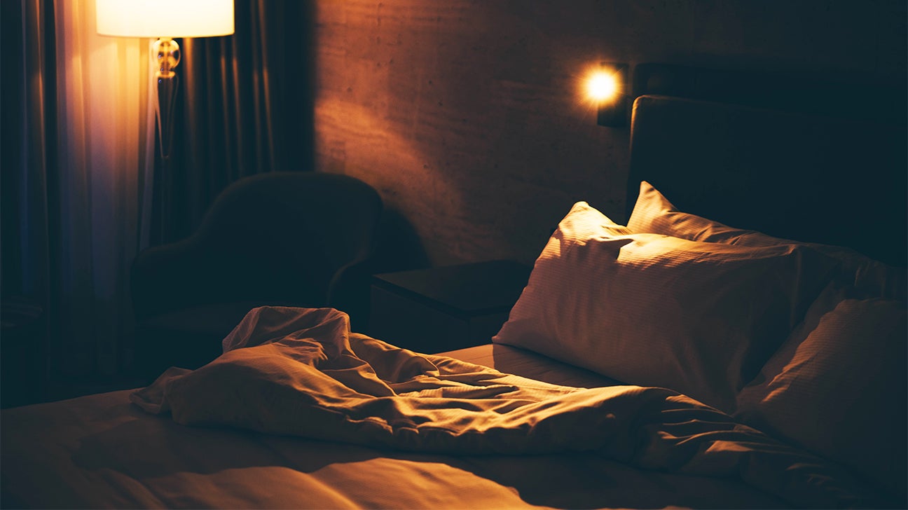 unmade bed night bedroom