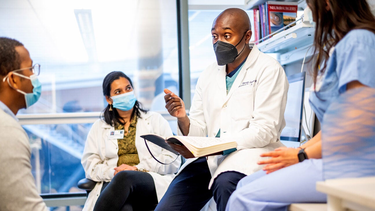 Dr. Shawn Hervey-Jumper talks to a surgical team at the University of California San Francisco