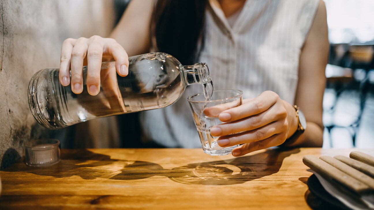 https://post.healthline.com/wp-content/uploads/2023/03/woman-pouring-water-into-glass-at-restaurant-1296x728-header-1296x729.jpg