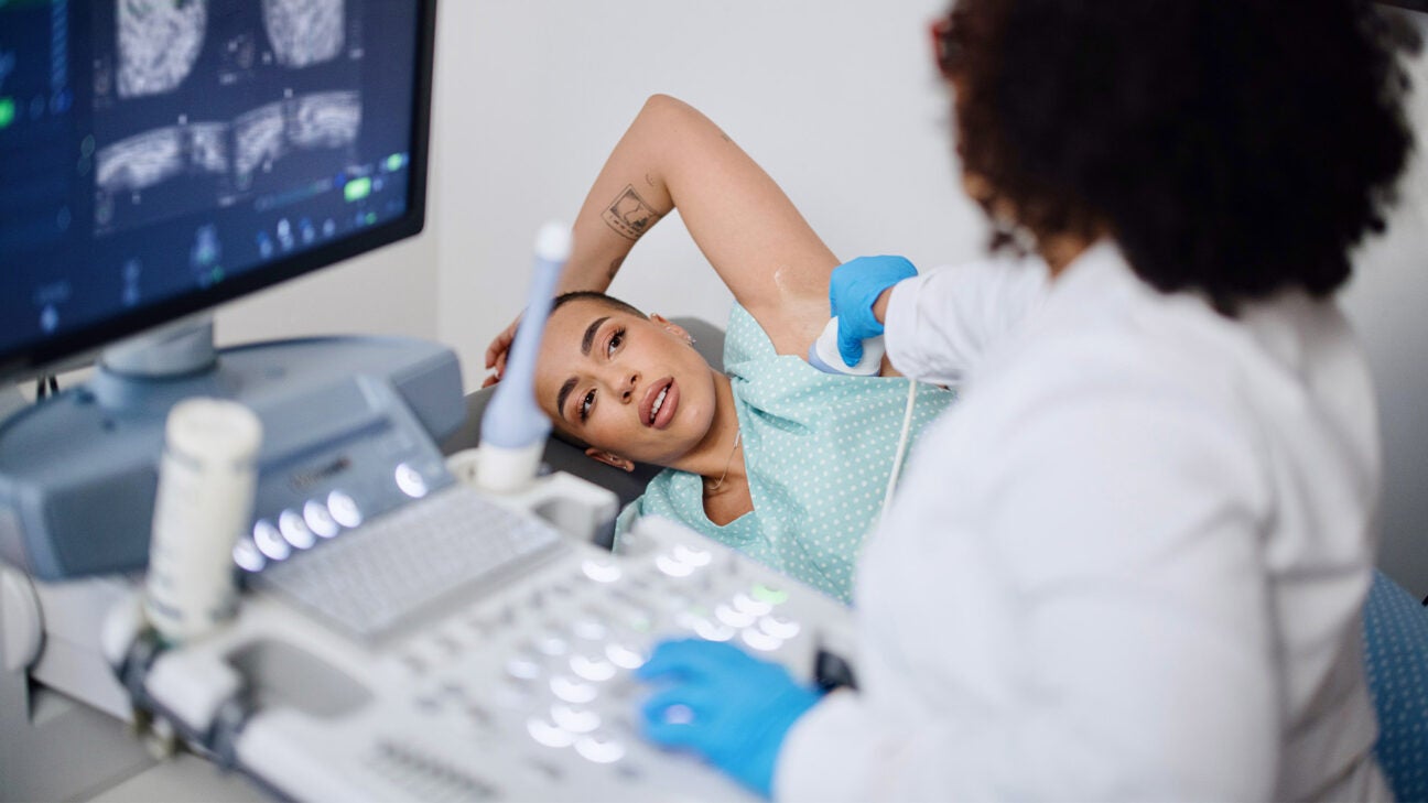 A woman being examined by a doctor.