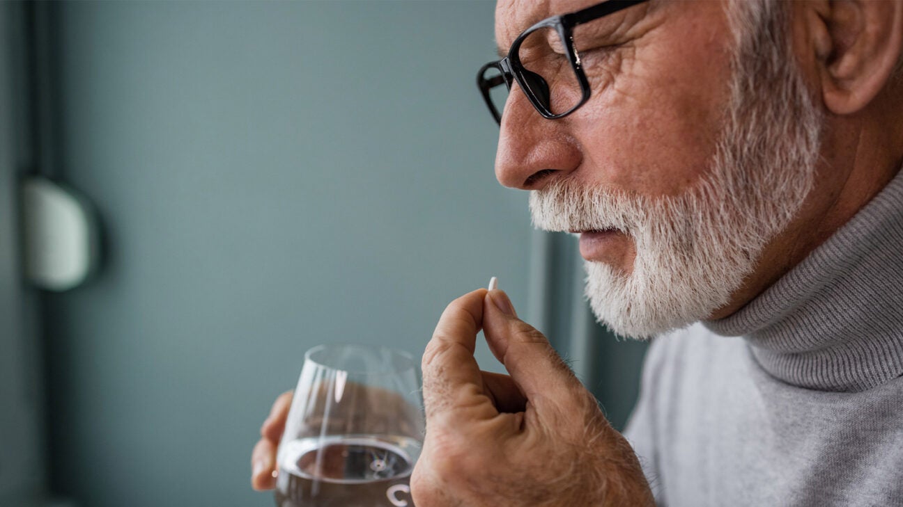 A man taking medication.