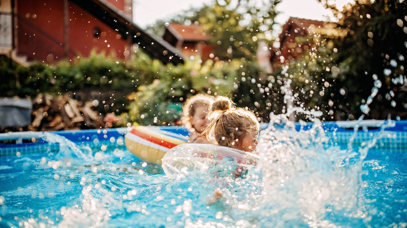 Children splash in a pool. 