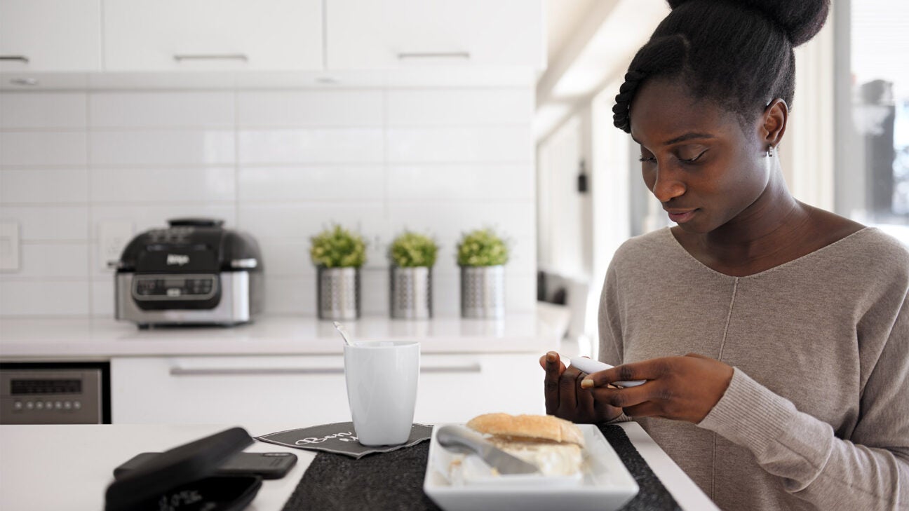 A woman eating a meal.