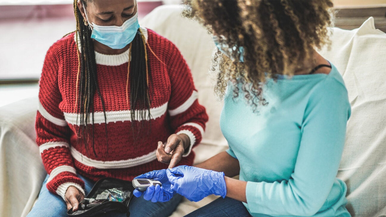 A person undergoes a finger-prick test.