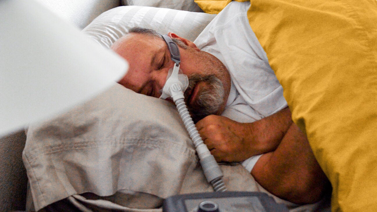 Man in a CPAP machine.