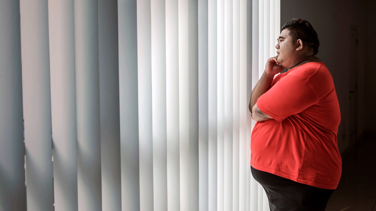 A man looking out a window.