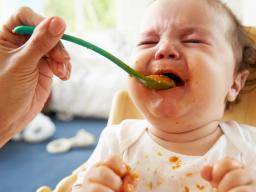 baby crying while eating