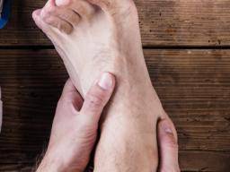 pain on top of foot with plantar flexion